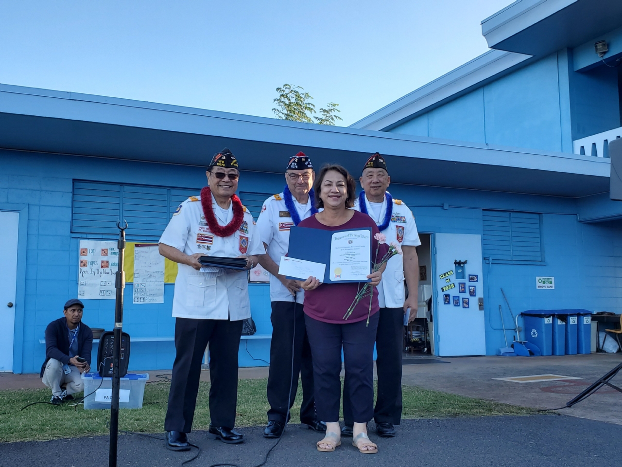 10276 Post Members awarding students at Our Lady of Good Counsel in Pearl City.